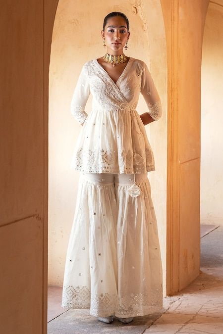 Buy Off White Peplum Top Cotton Mulmul Embroidery Angrakha And Sharara Set For Women by PREEVIN Online at Aza Fashions. Peplum Top Outfits Indian, Sharara Designs Simple, Trendy Ethnic Outfits, White Sharara, White Peplum Top, Work Photos, Sharara Designs, Off White Fashion, Kurta Sharara Set