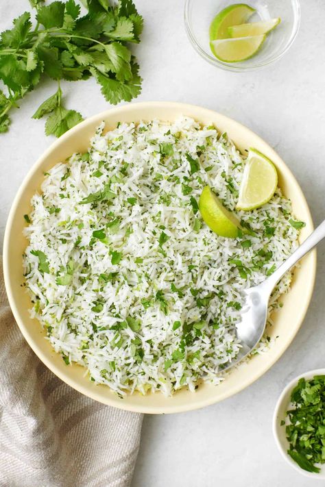 You're going to love this Cilantro Lime Rice! It's so fresh and zesty, with bursts of tangy citrus in every bite, making for a fantastic side dish. | Cilantro Lime Rice | Cilantro Lime Rice Recipe | Easy Cilantro Lime Rice | Easy Rice Side Dish | Lime Rice Cilantro, Feelgoodfoodie Recipes, Rice Cilantro Lime, Easy Cilantro Lime Rice, Cilantro Rice Recipe, Easy Rice Side Dishes, Coriander Rice, Cilantro Lime Rice Recipe, Vegetarian Burrito