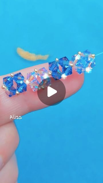 it's queen Aliza on Instagram: "Beautiful bicone beads bracelet tutorial for beginners 🥰  Nylon thread  Bicone beads Golden beads Lobster hook   #beadtutorial #beadedbracelet #seedbead #seedbeadbracelet #handmadejewelry #beads #beadsjewelry #beadsbracelet#kundanjewellery #jewellery #indianjewellery #earrings #bridaljewellery #polkijewellery #necklace #weddingjewellery #kundan #jewelry #kundannecklace #fashion #traditionaljewellery #indianwedding #diycrafts #smallbusiness #diypearlearrings #fabricearrings #easydiy #diyideas" Bicone Beads Bracelet, Diy Pearl Earrings, Beaded Bracelet Diy, Golden Beads, Kundan Jewelry, Beaded Bracelets Tutorial, Fabric Earrings, Polki Jewellery, Kundan Necklaces