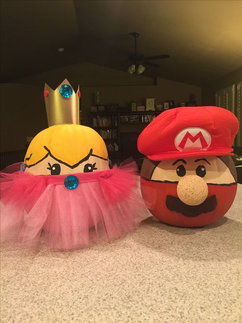 Mario and Princess Peach inspired faux pumpkins. Perfect for the class Pumpkin Contest! Princess Decorated Pumpkins, Pumpkins In Disguise, Super Mario Pumpkin Decorating, Mario Brothers Pumpkin, Mario Bros Pumpkin Painting, Princess Peach Pumpkin Painting, Super Mario Pumpkin Painting, Princess Peach Pumpkin, Princess Pumpkin Decorating