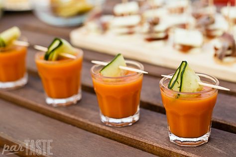 These gazpacho shooters with marinated cucumber ribbons are a refreshing appetizer that is easy to make and can be prepared in advance for large parties. The crunch of tangy marinated cucumbers provides a nice contrast to the smoothness of the gazpacho. Gazpacho Shooters, Spanish Tapas Party, Cucumber Ribbons, Tapas Ideas, Spanish Dinner, Paella Party, Tapas Dinner, Spanish Party, Spanish Tapas Recipes