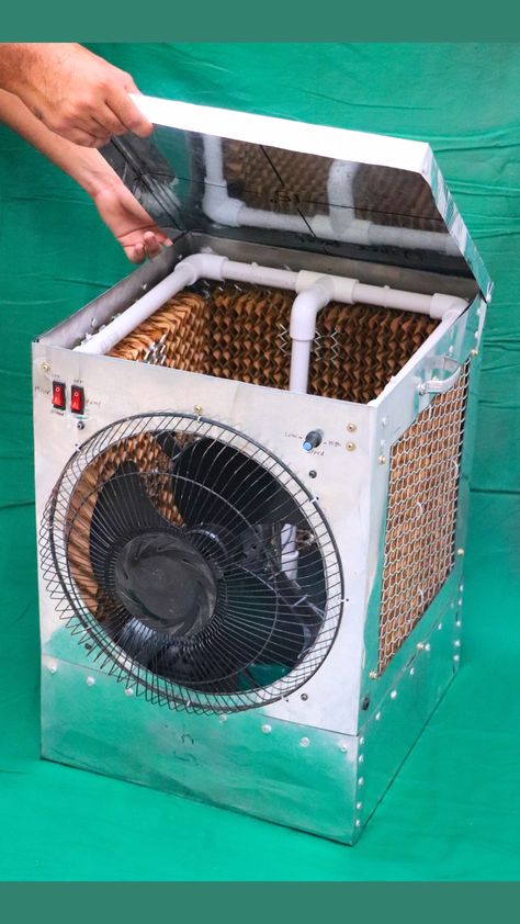 make 12v battery powered dc air cooler. I have used 24 gauge sheet metal, 12v dc fan motor, fan, dc water pump, pvc pipe, honeycomb cooling pad, aluminium ventilator grill, 13 inch fan safety grill, on-off switch, speed regulator, zip tie, screws and pop rivets. Solar Powered Air Conditioner, Ac Cooler, Safety Grill, Diy Ac, Secret Hiding Spots, Electronics Projects For Beginners, Diy Cooler, Water From Air, Water Pad