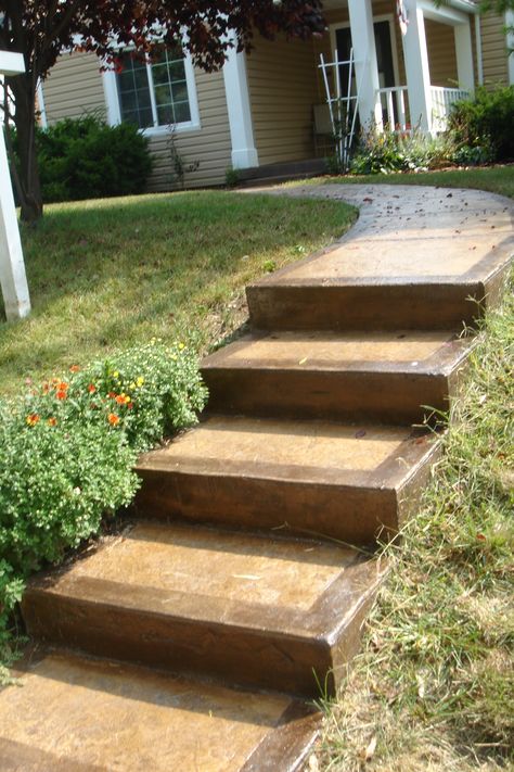 Stained concrete steps and walkway Walkway Concrete, Concrete Front Steps, Concrete Patterns, Stamped Concrete Walkway, Concrete Pathway, Landscape Stairs, Landscape Steps, Concrete Walkway, Sloped Backyard