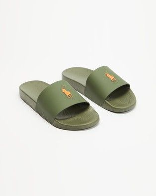 Perfect your weekend look with the Polo Ralph Lauren 's Polo Slide Sandals . These stylish and comfortable slides feature bold brand text to add a touch of spice to your casualwear. - Lightweight and damage resistant rubber-feel upp Polo Slides, Touch Of Spice, Iconic Australia, Lifestyle Shoes, Birkenstock Madrid, Pool Slides, Slide Sandals, Shoes Online, Birkenstock