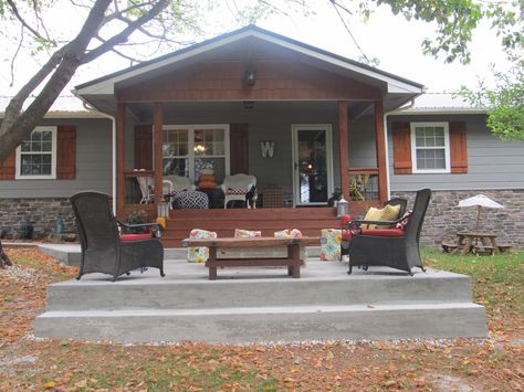 Front porch remodel after, fire pit, outdoor seating Front Porch Half Covered Half Not, Open Gable Front Porch Ranch Style, Cabin Front Porch Ideas Rustic, Double Wide Brick Skirting, Front Porch With Beams, Doublewide Exterior Makeover, Trailer Skirting Ideas, Double Wide Front Porch Ideas, Single Wide Trailer Remodel