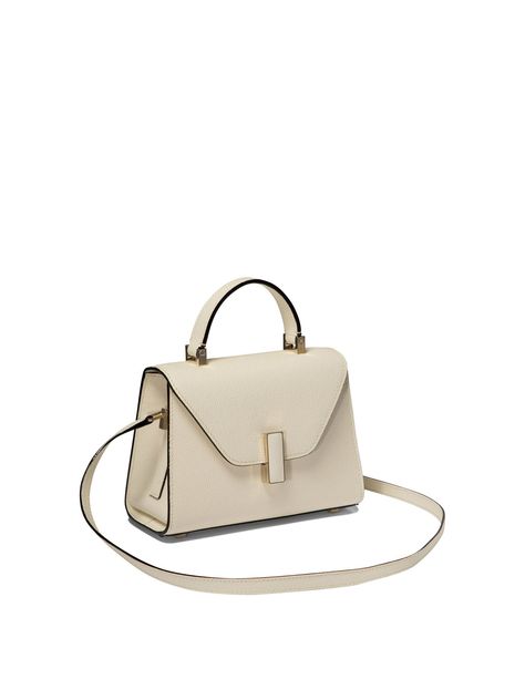 Find VALEXTRA Iside Micro' Crossbody Bag on Editorialist. Valextra's 'Iside Micro' shoulder bag is made of Millepunte calfskin with contrasting inlays and features a gold-tone metal clasp with leather insert. The removable and adjustable shoulder strap allows it to be worn comfortably over the shoulder or on the shoulder. Each bag has a unique serial number that identifies the date of production and the artisan responsible for its creation. Hand-painted Ink lines and black lacquered edges are distinctive details of Valextra bags. - Dimensions: 19.5x14x9.5 cm - Gold-colored metal clasp with leather insert - Removable and adjustable shoulder strap - Unique serial number for each bag - Hand-painted Ink lines - Black lacquered edges - Versatile style suitable for any occasion For the elegant w Valextra Bag, Valextra Iside, Micro Bags, Hand Bags For Women, Leather Satchel Bag, Style Noir, Crossbody Tote, Womens Crossbody Bag, Black Cross Body Bag