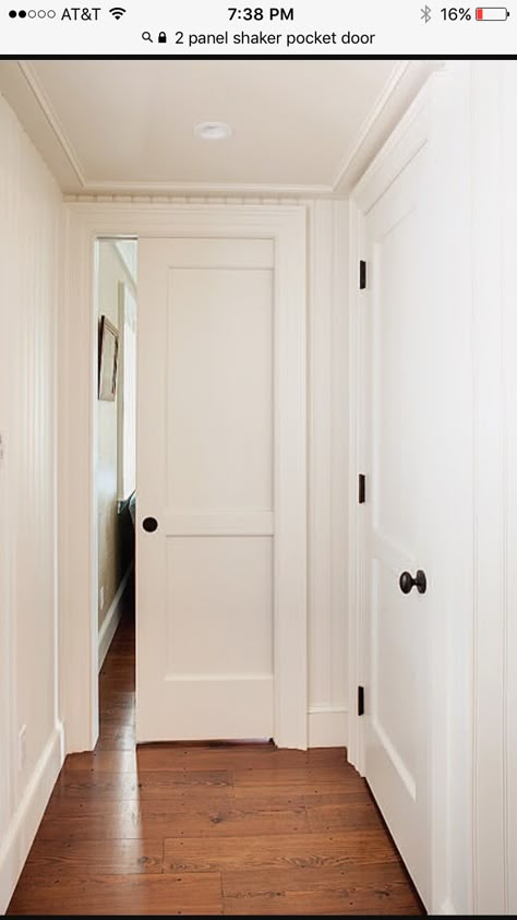 Pocket Doors Hallway, Hallway Pocket Door Ideas, Shaker Three Panel Door, Interior Doors Without Molding, Shaker Style Pocket Door, Pocket Door Styles, Cool Pocket Doors, Pocket Door Hallway, Large Interior Doors