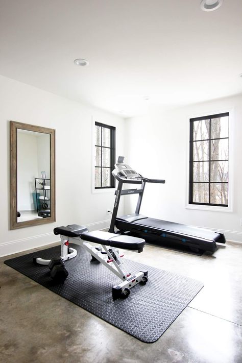 Here are some tips for setting up your own home gym! #basement #basementgym #homegym #concretefloors #blackwindows Outside The House Ideas, Treadmill Home Gym, Small Gym Layout, Turn Garage Into Gym, House Gym Ideas Small Spaces, House Gym Room, Gym In Home, Home Gym And Office Combo, Gym Corner At Home