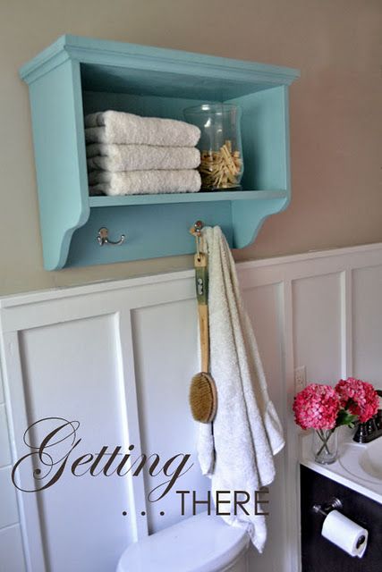 DIY bathroom storage shelf. Love this one...even the color scheme. Wall Storage Shelf, Bathroom Shelf With Hooks, Store Towels, Shelf With Hooks, Wall Storage Shelves, Over The Toilet, Diy Bathroom Storage, Simple Woodworking Plans, Bathroom Storage Shelves