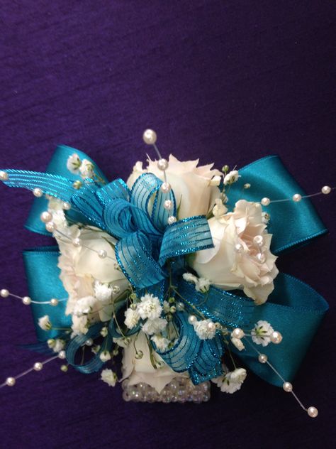 Wrist corsage using turquoise ribbon, white spray roses, baby's breath and pearls on an iridescent wrist bracelet. March 2016 White Corsage, Prom Corsage And Boutonniere, White Spray Roses, Ribbon White, Corsage And Boutonniere, Corsage Prom, Pretty Wedding Dresses, Prom Flowers, Wrist Bracelet