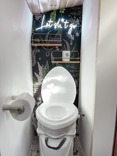 A skoolie bathroom inspiration piece with composting toilet and neon sign. Renovation and DIY inspo with a dark wallpaper accent piece! Tiny living conversion. Skoolie Bathroom, Bus Build, Skoolie Conversion, Camper Bathroom, Rv Bathroom, Diy Camper Remodel, Stylish Interior Design, Composting Toilet, Green Cabinets