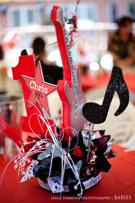 Rock N Roll Table Centerpiece. This is my favorite centerpiece and then we could have red/white/silver/black with music note balloons on each one. Rock And Roll Party Centerpieces, Rock And Roll Table Decorations, Rock And Roll Centerpieces, Rock Theme Centerpieces, Rock And Roll Party Decorations Table Centerpieces, Rock Band Centerpieces, Music Table Decorations, Kiss Birthday Party, Music Centerpieces