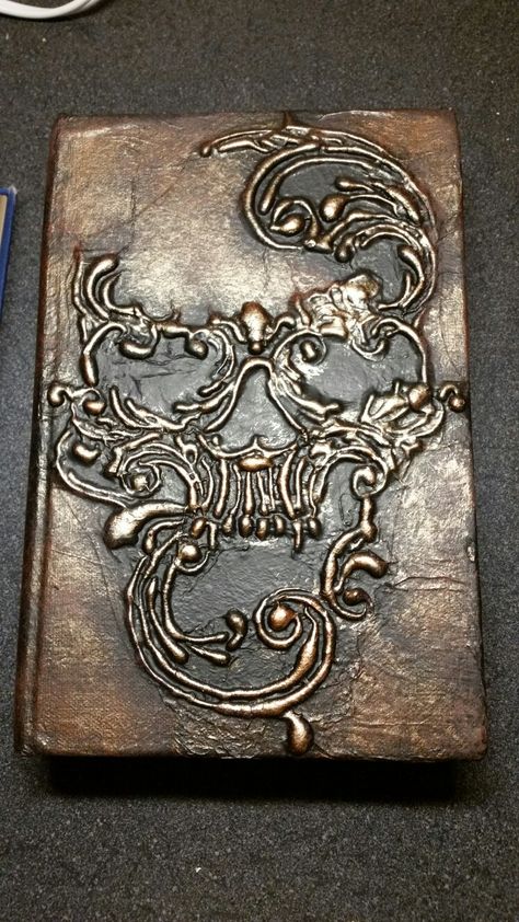 book. Used hot glue to define the design and mod podge with tissue paper to give it a "skin-like" appearance. Painted with acrylic paint Crafts Hot Glue, Hot Glue Art, Macabre Decor, Diy Mod Podge, Steampunk Mixed Media, Old Book Crafts, Glue Craft, Acrylic Painting Inspiration, Glue Art