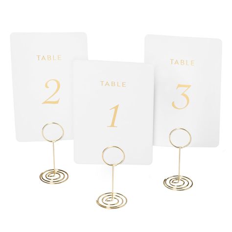 PRICES MAY VARY. ELEGANT & SOPHISTICATED | These luxury table numbers and holders add a touch of refinement to weddings and fine events alike. CRAFTED WITH QUALITY | Made from premium materials, these gold table numbers are designed to withstand repeated use, ensuring they remain in excellent condition for years to come. THE PERFECT AMOUNT | With numbers ranging from One to Thirty, a "Head Table" card and a bonus blank card, these double sided wedding table numbers make it easy to keep your even Seating Signs For Wedding, Gold Table Number Holders, Table Card Holders, Seating Arrangement Wedding, Signs For Wedding, Table Number Stands, Gold Table Numbers, Seating Sign, Table Card Holder