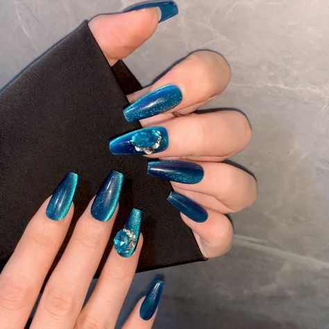 These ocean blue nails shimmer like deep-sea gems! 💎💅 With gemstone accents, every gesture is steeped in luxurious charm. #presson #pressons #pressonnail #pressonnails #falsenails #virtuvogue #virtuvoguenails #bluenails #gemnails #ballerinanails #coffinnails #longnails #cateyenails Ocean Blue Nails, Nails Shimmer, Press On Nails Blue, Vogue Nails, Blue Cat Eye, Cover Nails, Sea Nails, Nail Collection, Long Press On Nails