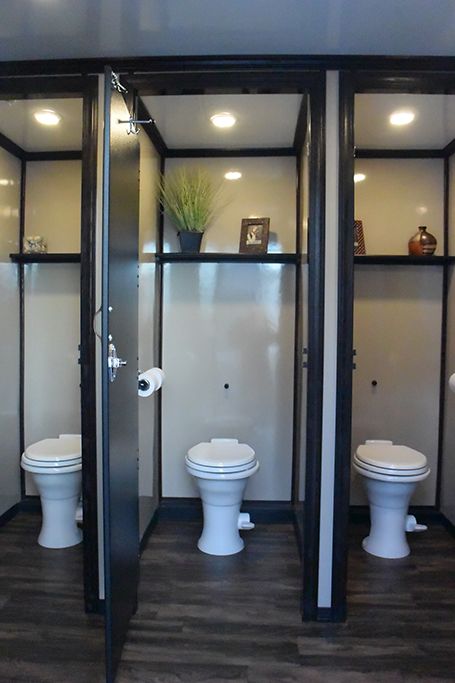 Multiple Shower Stalls Bathroom Ideas, Diy Bathroom Stalls, Wedding Venue Restrooms, Horse Trailer Bathroom Ideas, Bathroom Stalls Aesthetic, Bathroom Stall Ideas, Warehouse Bathroom, Church Backdrop, Portable Homes