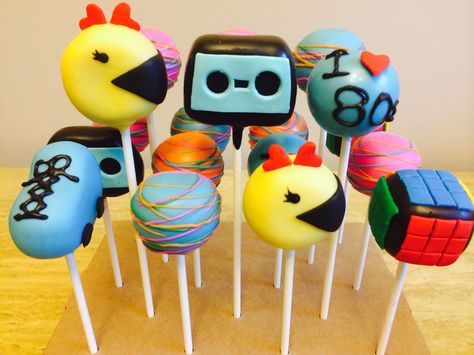 80s Theme Cake Pops | Ms Pacman cake pops | Rubik's cube cake pops | rollerskate cake pops | cassette tape cake pops 80s Theme Cake Pops, Cassette Tape Cake, 80s Theme Cake, 80s Themed Cake, Rollerskate Cake, 80s Cake, Ms Pacman, Themed Cake Pops, Cube Cake