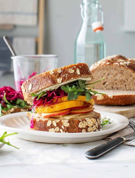 This butternut apple cranberry sandwich is a delicious, healthy lunch or dinner. Totally vegetarian, it's filled with roasted butternut squash, white cheddar, apples, dried cranberries, and pickled cabbage for pop. Squash Sandwich, Marinated Cabbage, Cranberry Sandwich, Fall Sandwiches, Butternut Squash Recipes Easy, Apple And Cheddar, Best Cabbage Recipe, Fall Lunch, Easy Butternut Squash