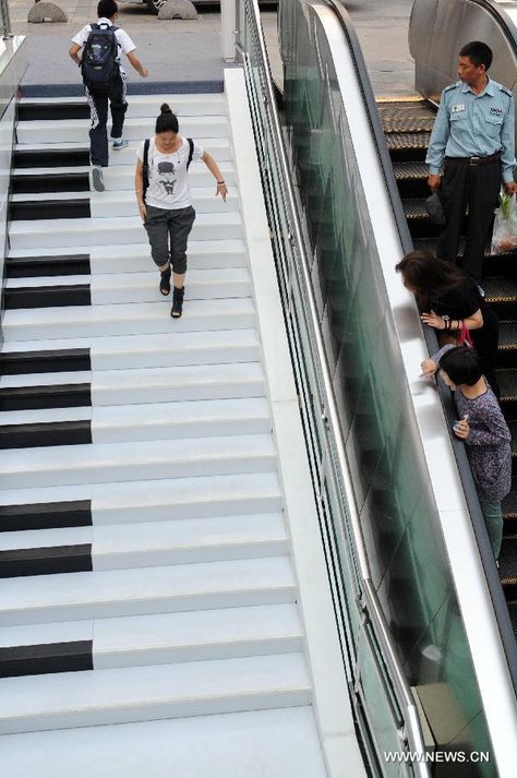 <p>In Wulin Plaza in Hangzhou, China each step plays a musical note as you walk on it.</p> Piano Stairs, Hangzhou China, Modern Metropolis, Take The Stairs, Street Marketing, Guerilla Marketing, Stairway To Heaven, Musical Note, Hangzhou