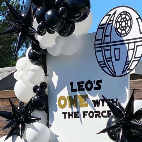 Bizzie Bee Creations on Instagram: "May The 4th Be With You! Leo’s ONE With The Force! Baby Star Wars Set up. Design, set up, props by @bizziebeecreations || Balloons @creativeballoons__ || Decals @meritsigncompany || Small Arch Wall @wolfelaserengraving #babystarwars #starwars #starwarspartytheme #starwarsparty #starwarsdecor #starwarsbirthday #kidparty #kidpartyideas #kidsparty #kidspartyideas #event #eventplanner #eventstylists #eventstyling #eventdesign #eventdecor #partydecor #partyideas #partydecorations #partyinspiration #backdrop #balloons #propstylist #decals #proprental #firstbirthday #birthday #birthdayparty #maythe4thbewithyou" Star Wars Birthday Backdrop, The Force Is Strong With This One 1st Birthday, One With The Force Birthday, The Force Is Strong With This One Birthday, Star Wars Balloon Arch, One With The Force First Birthday, Star Wars First Birthday, Star Wars Theme Party, Star Wars Set