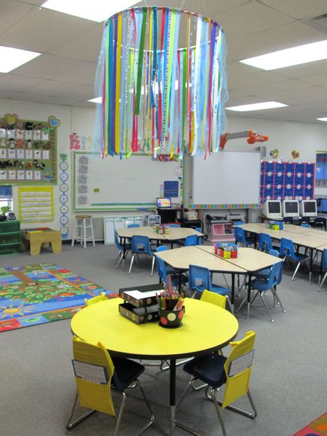 Added a simple ribbon chandelier from a hula hoop over the Writing Spot Table this year Classroom Chandelier, Hula Hoop Chandelier, Preschool Circle Time Activities, Walker Learning, Classroom 2023, Ribbon Chandelier, Classroom Diy, Circle Time Activities, Preschool Circle Time