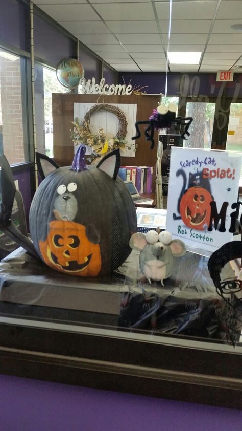 My Scaredy-cat, Splat pumpkins on display in the office window. #scaredcatsplat #robscotton #splatthecat #paintedpumpkins Pumpkin Painting Ideas Childrens Book, Children’s Book Character Pumpkin, Splat The Cat Pumpkin, Story Book Pumpkin Decorating Ideas, Book Pumpkins, Storybook Pumpkin, Splat The Cat, Piggie And Elephant, Library Halloween