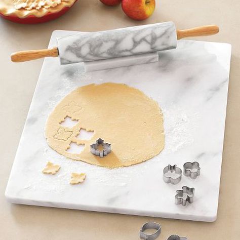 When chilled, a marble surface is ideal for keeping dough from sticking -- particularly when youre not keen on adding too much extra flour. If youre an avid baker, its an essential tool to have in your kitchen. And you can get one for around $30! Baking Station, Marble Pastry Board, Bakers Kitchen, Marble Board, Pastry Board, Marble Surface, Kitchen Must Haves, Pastry And Bakery, Baking Gifts