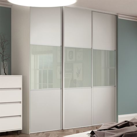 The Linear range is available in a 3 panel design come in a variety of glass and mirror finishes, with different wood effect or silver frames. Choose the finish that best suits your scheme and create a real statement in your bedroom. Or for a creative storage solution, use sliding doors to hide away clutter in the hallway. Two guides are attached to the top of the door and two wheels to the bottom which allows the door to slide along the track set.Looking for made-to-measure doors and interiors? White Glass Wardrobe Doors, Closet Doors Sliding Mirror, Mirror Closet Doors Makeover, Sliding Mirror Closet Doors Makeover, Mirror Closet Door Makeover, Bedroom Built In Closet, Glass Wardrobe Doors, White And Silver Bedroom, Glass Sliding Wardrobe Doors