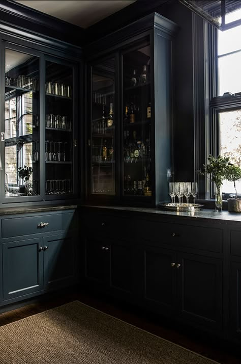 Black marble countertops on a black butler pantry built-in feature glass doors and brass cup pulls. Black Glass Door, Black Marble Countertops, Glass Door Cabinet, Bourbon Room, Library Bar, Bookcase Bar, Whiskey Room, Butler’s Pantry, Dark Kitchen