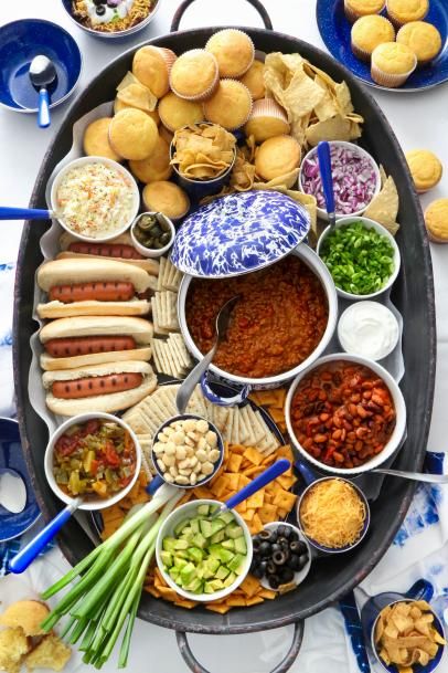 Chili Charcuterie Board for Game Day, Super Bowl, Award Shows or Winter Gatherings | HGTV Halloween Chili Charcuterie Board, Halloween Chili Party, Chilli Charcuterie Board Ideas, Chilli Charcuterie Board, Chilicuterie Board, Chili Boards, Chili Buffet Bar, Chili Board Ideas, Lunch Bar Ideas