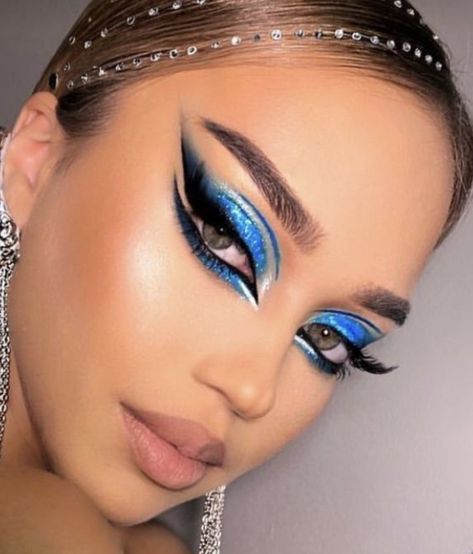 Gorgeous blue glitter eyeshadow look with killer smoked out liner with beautiful lashes. #makeupIdeas #makeuplooks #makeupinspiration #makeup Ballroom Makeup Blue, Melbourne Cup Makeup, Blue Dance Makeup, Blue Stage Makeup, Freestyle Disco Dance Makeup, Vegas Showgirl Makeup, Blue Bird Makeup, Blue Carnival Makeup, Dramatic Blue Eye Makeup