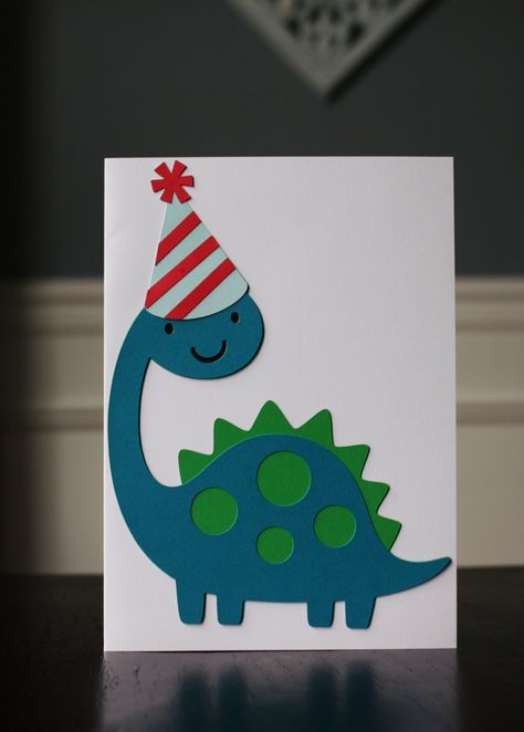 Do you have a dinosaur lover that's having a party? If you do this birthday card is perfect for you! It is made of heavy duty card stock and measures 5x 7 inches.  This listing is for one card and envelope. The card is blank inside for your personal message! If you would like different colors or different amounts just message me!  I am happy to do custom orders! Thank you for visiting my shop! Dinosaur Birthday Card, Happy Birthday Cards Printable, Dinosaur Cards, Birthday Card Craft, Birthday Cards For Boys, Bday Cards, Card Making Crafts, Thanks Card, Birthday Card Printable