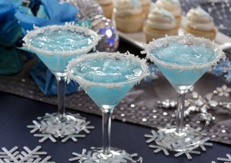 Jack Frost Martini  1 cup pineapple juice 1/2 cup (4 ounces) light rum or vodka 1/2 cup (4 ounces) blue curacao 1/2 cup (4 ounces) cream of coconut (not coconut milk) 10 to 12 ice cubes Shredded coconut, for garnish  Mix together the juice, liquors, cream of coconut and ice; strain into martini glasses. Rim glasses with the shredded coconut. Makes 4 drinks. Jack Frost Drink, Cream Of Coconut, Winter Cocktail, Light Rum, Milk Shakes, Munnar, Blue Curacao, Blue Hawaiian, Kool Aid