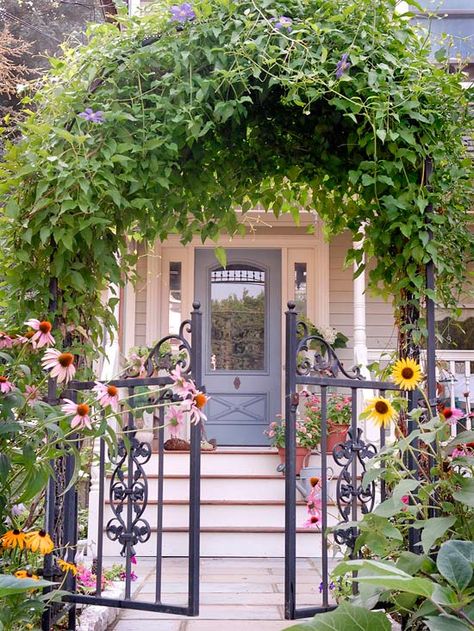 What do you think of this vine-covered arbor? More front yard flower gardens: http://www.bhg.com/gardening/landscaping-projects/landscape-basics/front-yard-flower-power/?socsrc=bhgpin080612vinearborentrance#page=14 Small Front Gardens, Front Garden Design, Front Yard Garden, Iron Gate, Beautiful Doors, Landscape Projects, Garden Gates, Front Garden, Dream Garden