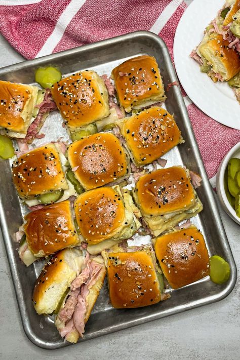 These Cuban sliders on Hawaiian rolls are a great option when you need an appetizer, a snack, or even just an easy dinner. The Hawaiian rolls give these Cuban sliders just the right amount of sweetness, and the sauce and spice mixture gives them just the right amount of tanginess, making the perfect melt-in-your-mouth sandwich. Cuban Sliders Hawaiian Rolls, Sliders Hawaiian Rolls, Sliders Sandwiches, Sliders On Hawaiian Rolls, Hawaiian Bread Rolls, Cuban Sliders, Hawaiian Buns, Tenderloin Recipes, Tailgate Food