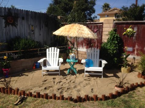 Love this idea for a backyard beach, pails, folding table Sand Area In Backyard, Beach Theme Backyard Ideas Patio, Mini Beach In Backyard, Sand Backyard Ideas, How To Make A Beach In Your Back Yard, Backyard Tanning Area, Beach Backyard Ideas, Sand Backyard, Beachy Backyard