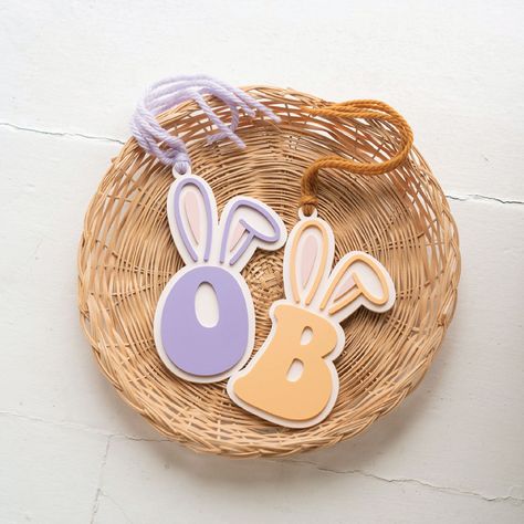 "Personalized bunny ears tag perfect for your little one's Easter baskets! : . : . : ITEM DETAILS : . : . : This tag is laser cut from acrylic. Tag measures approx. 3.5\" wide. Each tag comes with ONE initial in the font shown. Select your initial + ear color from the dropdown menu. Chunky yarn will coordinate to acrylic color selected. : . : . : PLEASE NOTE : . : . : This product is handmade to order. Please allow 3 - 10 business days for me to design, cut, assemble, and package your item befor Woman Costumes, Bumble Bee Birthday, Custom Bunny, Basket Tags, Basket Tag, Dog Christmas Stocking, Easter Bunny Ears, Easter Basket Tags, Easter Tags