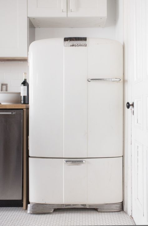 A restored vintage Kelvinator refrigerator. Octagon Tile Floor, Nancy Meyers Kitchen, Antique Brick Wall, High Ceiling Bedroom, 1940s Cottage, Octagon Tile, Retro Kitchen Appliances, New Fridge, Vintage Refrigerator