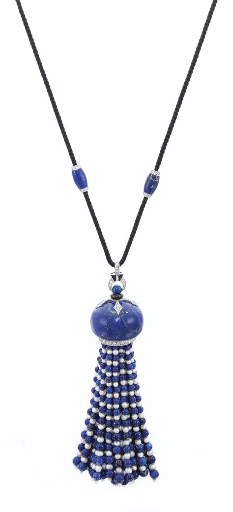 GEM SET AND DIAMOND LARIAT, CARTIER, CIRCA 1930  Suspending a tassel of seed pearls and lapis lazuli beads, to a carved lapis lazuli cupola mount millegrain-set with rose and single-cut diamonds, to a silk cord set with enamel tassels, length approximately 345mm, French assay and maker's marks. Diamond And Pearl Necklace, Lapis Lazuli Jewelry, Cartier Jewelry, Tassel Jewelry, Deco Jewelry, Seed Pearl, Art Deco Jewelry, Gems Jewelry, High Jewelry