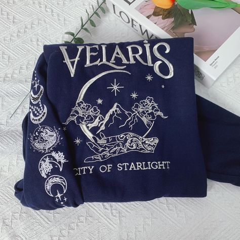 The perfect gift meticulously embroidered to the last detail for book lovers 📚🪡🧵 • • Size S-5XL #bookclub #bookrecommendations #booklovers #acotarseries #acotarmemes #acotar #fourthwingfanart #book #bookcommunity #acotarfanart #throneofglass #nightcourt #books #bookstagram #booklove #fantasy #romancebooks #fourthwingrebeccayarros #throneofglassfanart #fandomedits #velaris #romancedark Fantasy Embroidery, Acotar Velaris, Velaris City Of Starlight, City Of Starlight, Romance Reader, Personalised Gifts For Friends, Night Court, Romantic Fantasy, Embroidery Hoodie