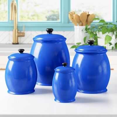 Simple in design yet versatile in function, this four-piece storage jar set is a must-have addition to your well-decorated space. Crafted from ceramic, this set's solid glazed finish blends effortlessly into any colour palette, while its curved silhouette adds a touch of visual appeal to your decor. Not only a vessel for storing dry ingredients or cotton balls and toiletries, but this jar set can be used to decorate a bookshelf or mantel as well! The included lids feature a rubber seal to protec Decorate A Bookshelf, Palladian Window, Kitchen Storage Canisters, Kitchen Canister Set, Storage Canisters, Cotton Balls, Well Decor, Kitchen Canisters, Bookshelf Decor