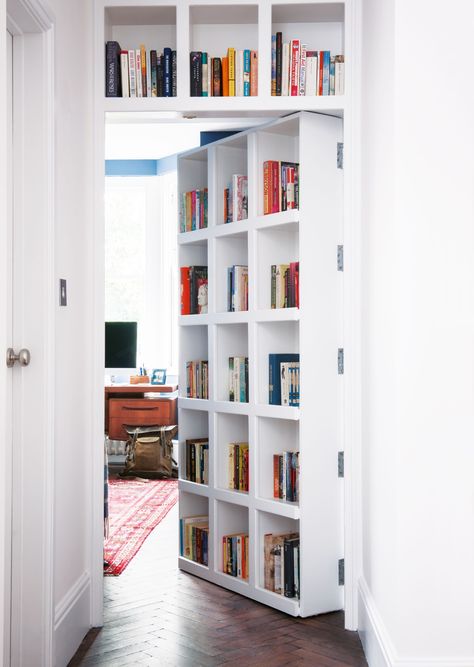 Didn't think you had room for any book storage in, say, a narrow hallway? Think again. This book shelf has been built into a door so it doesn't take up any extra space. #hallway #smallhallway #storage #realhomes Gömda Rum, Dold Dörr, Hidden Door Bookcase, Bookshelf Door, Bloxburg Basement, Small Hallway Ideas, Home Library Design, Real Homes, Hidden Rooms