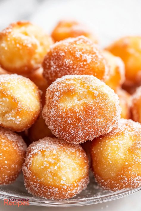 Easy Zeppole (Italian Donuts) Recipe - EasyWorldRecipes Olive Garden Donuts Recipe, Bombolini Donut Recipe, Homemade Doughnut Holes, Perfiteroles Recipe, Doughnut Holes Recipe Easy, Zeppoli Recipe Italian, Crispy Cream Donuts Recipe, Easy Donut Hole Recipe, Italian Donuts Recipe