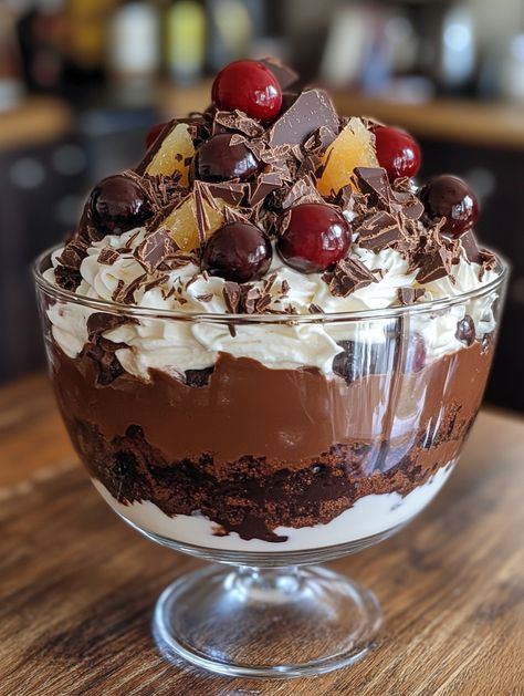 Ingredients 🥛 600g dark chocolate (finely chopped, plus extra to serve) 🍫 600mL thickened cream 🥛 750g cherries (pitted) 🍒 1 ½ tbsp caster sugar 🍬 1 ½ orange (finely grated rind and juice) 🍊 600g chocolate cake (crumbled) 🍰 1 cup caster sugar 🍬 ¼ cup water 💧 𝗠𝗲𝘁𝗵𝗼𝗱: 1. Prepare the Chocolate Mousse: In a glass bowl over a saucepan of simmering water, stir the chopped chocolate until melted (2-3 minutes). Cool briefly. Whisk the cream in an electric mixer until soft peaks form. Cherry Trifle, Trifle Bowl Recipes, Thickened Cream, Trifle Dessert Recipes, Trifle Desserts, Trifle Recipe, Sweet Snacks Recipes, Homemade Snacks, Electric Mixer