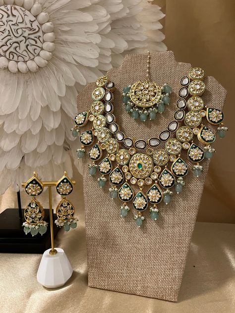 Beautiful Wedding Wear Artificial Jewelry Set/ Indian Bridal Set/ Kundan Necklace Set/ Traditional Jewelry Set/ Kundan Choker Necklace Set Type: Necklace Set Color: Gold & Blue Style: Kundan  Set Includes: Necklace + Earrings + Tikka All the raw material used in this product is of high quality and is handcrafted with love. Premium Quality and High craftsmanship Luxury Designer Kundan Jewelry, Luxury Bollywood Tilla Kundan Necklace, Luxury Fusion Meenakari Jewelry Sets, Luxury Bollywood Kundan Necklace With Tilla, Luxury Chandbali Bridal Necklace For Rituals, Luxury Traditional Kundan Necklace For Anniversary, Luxury Temple Jewelry Bridal Necklace For Navratri, Luxury Ornate Kundan Necklace For Festivals, Luxury Kundan Necklace For Party