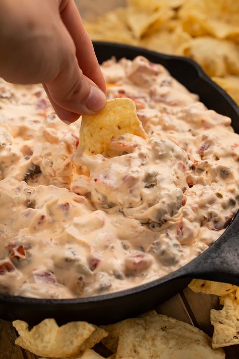 3-Ingredient Sausage Dip (Stovetop or Crockpot) from 40 Aprons | Made with only three ingredients, this sausage dip is always the star of any party. Creamy, savory, and loaded with flavor! Rotel Dip Crockpot, Hot Dog Soup, Mochi Brownies, Rotel Dip With Sausage, Accordion Potatoes, Dog Soup, Sausage Appetizers, Pork Breakfast Sausage, Dinner Party Appetizers