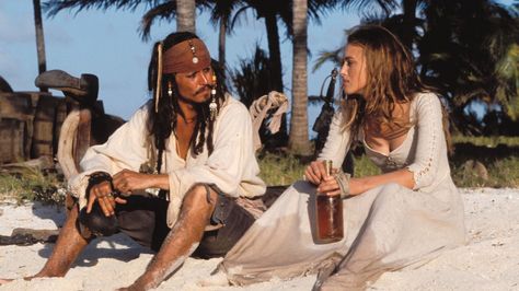 PIRATES OF THE CARIBBEAN ~ Captain Jack Sparrow and Elizabeth Swan have a 'heart to heart' chat and some rum after being stranded on a desert island. Jack Sparrow, The Caribbean, A Man, The Beach