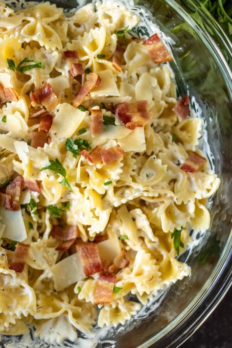 Creamy Bow Tie Pasta with bacon is simple comfort food that is easy to customize with grilled chicken, veggies, or delicious as is. With only seven ingredients and 30 minutes, you can have a family favorite on the table. | www.persnicketyplates.com Bacon Bow Tie Pasta, Bow Tie Pasta Recipes Healthy, Chicken Pasta Recipes Bowtie, Chicken With Bow Tie Pasta, Bacon Bowtie Pasta, Bow Tie Pasta And Chicken Recipes, Chicken Broccoli Bowtie Pasta, Bow Ties Pasta Recipes, Chicken Bacon Bowtie Pasta