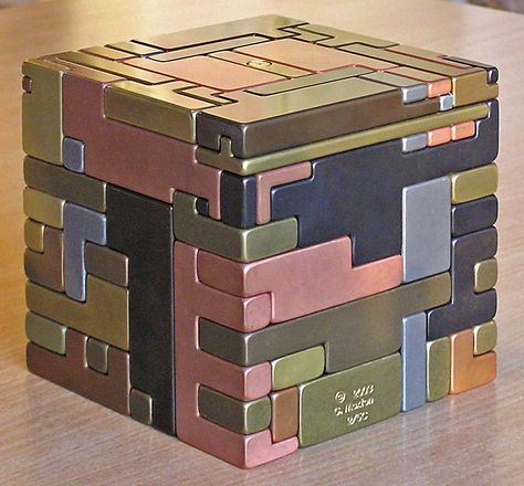 5" sq all metal puzzle. Pieces must be slid in a special sequence, hidden keys and hidden storage space. Idea from Japanese puzzle boxes. Japanese Puzzle Box, 3d Maze, Cnc Manufacturing, Japanese Puzzle, Puzzle Boxes, Woodworking Tools Workshop, Metal Puzzles, Window Projects, Secret Box