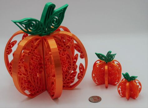 These delicate scrollwork pumpkins are 3D-printed in a shiny satin PLA orange with a green stem. Each is comprised of four parts and easily assembles and disassembles for storage between holidays. These pumpkins are perfect for tiered trays and table centerpieces or to display on a mantle or shelf. They would also make nice gifts for teachers and coworkers. Who doesn't love a little pumpkin spice when the leaves are turning colors? Chose from four designs for the pumpkin panels: Leaves Large Swi Fall Paper Quilling, Fall Quilling, Halloween Quilling, Quilling Artwork, Tray Centerpiece, Quilling Dolls, Paper Quilling For Beginners, Paper Quilling Patterns, Quilling 3d